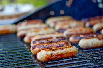 Some delicious pork sausages on the barbecue during summer months
