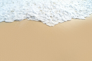 Photo of sea water with white waves and empty sandy beach at sunny day. Summer. Tropical landscape. Ocean.