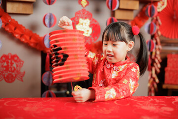 young girl with traditional dressing up celebrating Chinese new year against all kind of 