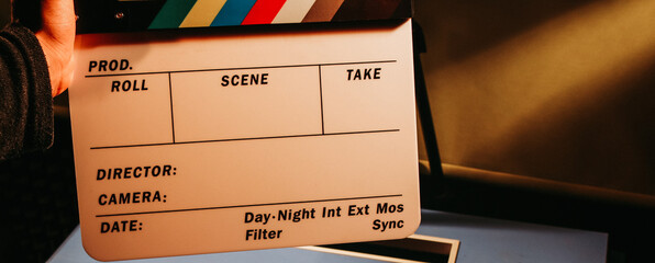 hand holding clapboard. cinema movies.