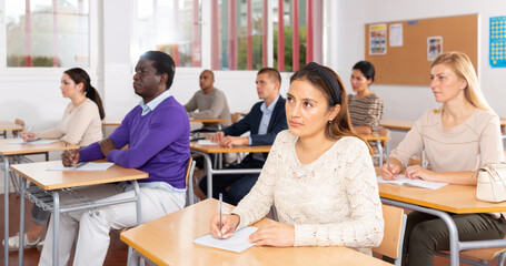 Fototapeta premium Multinational group of different age students at extension courses