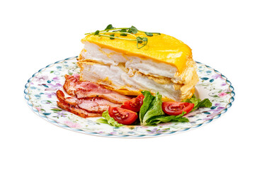 Omelette layered with fried bacon and fresh vegetables. Breakfast.