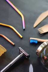 Various sustainable beauty products and kitchen utensils on dark background. Selective focus.
