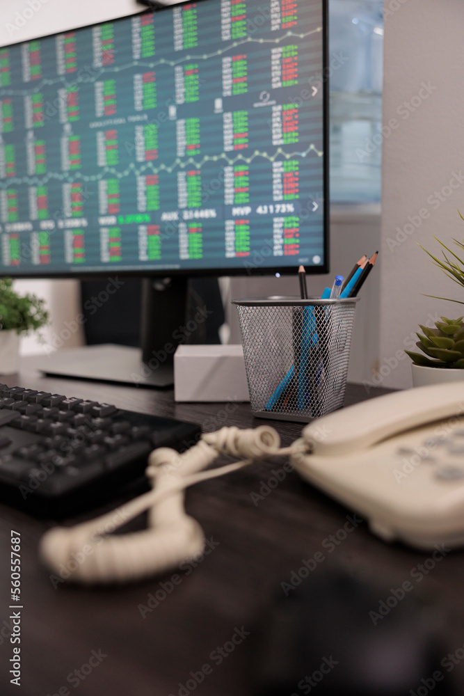 Poster monitor workstation and empty positions with stock market statistics on the screen, monitoring real 