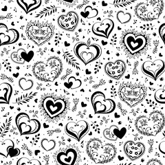 Fototapeta premium Romantic seamless pattern with cute hand drawn hearts with flowers and leaves. The style of folk drawing.