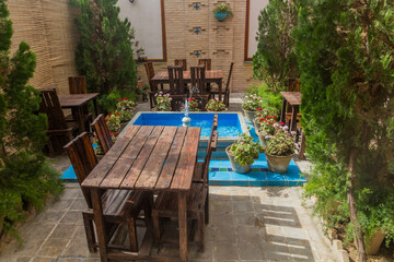 Tables of a small garden restaurant in Isfahan, Iran