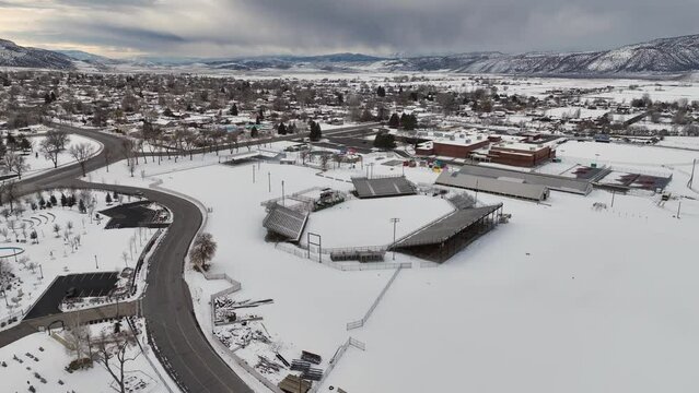 Winter at the rodeo grounds in small mountain town from drone perspective