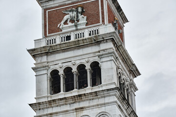 Fototapeta na wymiar MAY 20, 2017 - VENICE, ITALY: Close up showing details of the top of the bell tower at Saint Mark's Square, Campanile di San Marco.