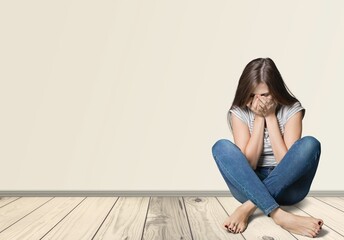 Depression young woman in crisis sitting at home