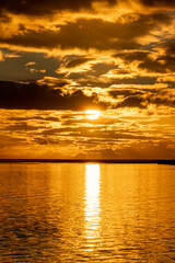 Fototapeta premium Orange sunset clouds with beautiful sun sky scape 
