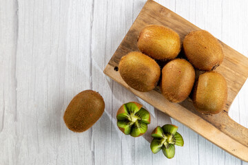 Fresh Kiwi fruit on the table.