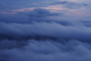 Landscape photo of mountains and clouds at dawn.
Feeling gentle.