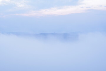 Landscape photo of mountains and clouds at dawn.
Feeling gentle.