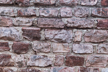 A brown brick wall. Repeated background of the Stone Wall