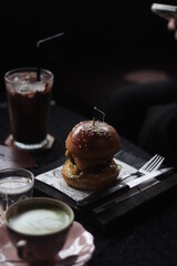 Close up a cup of Matcha green tea Latte art hot drink on wooden table background