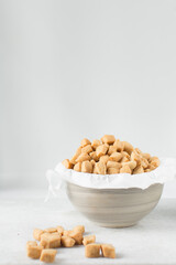 Nigerian Chin chin in a ceramic bowl, Fried chin-chin snack in a bowl, Nigerian party food and small chops