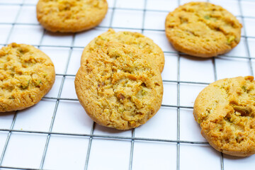 pistachio and almond cookies on white background.