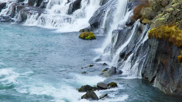 Autumn Waterfall in Iceland. Pure Turquoise Water in Mountain River. Popular Tourist Spot. Famous Travel Destination. Beautiful Nature, Unusual Landscape. Footage Shot in 8K Resolution 4320p