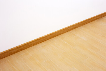 Naklejka na ściany i meble Wooden pattern tiles floor with blank white wall