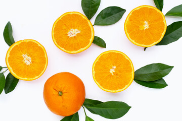 Orange fruit with green leaves on white background.