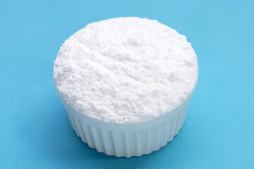 Baking soda on blue background.