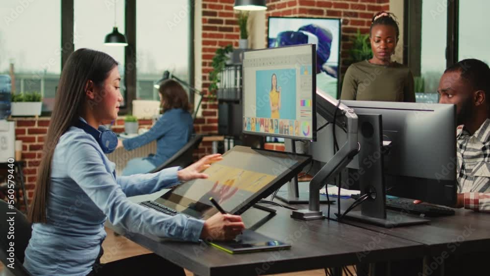 Poster artistic graphic designer working with touchscreen monitor to edit images, using tablet and stylus p