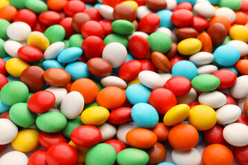 Many small colorful candies as background, closeup