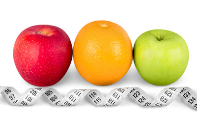 Apples and orange with measuring tape isolated on white