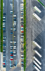 Car park with different color cars and vehicles parked in order, top down view