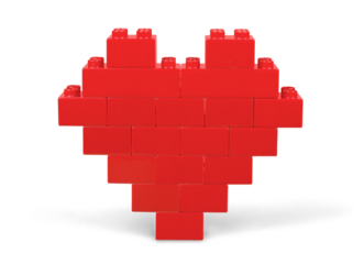 Red heart shape made of bricks on white background
