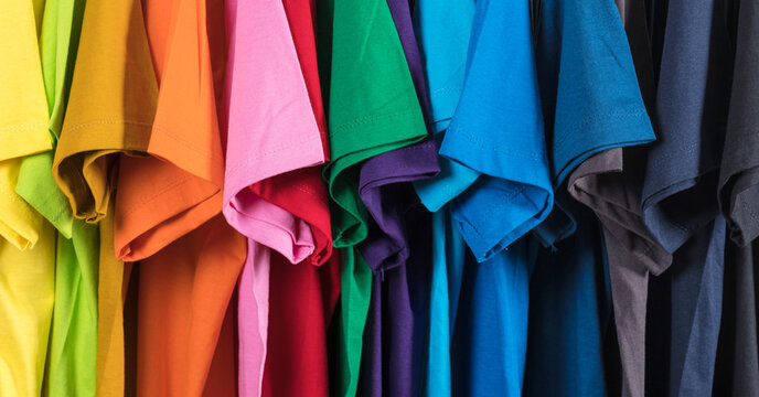 Colorful t-shirts hanging on a rack