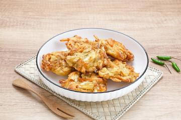 Bakwan sayur or bala-bala or vegetable fritter, Indonesian snack made from flour, cabbage, carrots and bean sprouts, served with chili
