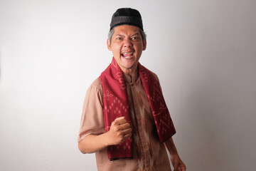 happy asian muslim man clenched his hands