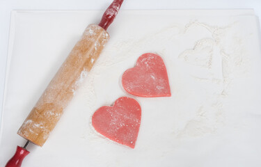 Pink Cookie Dough Hearts on Floured Surface with Rolling Pin 
