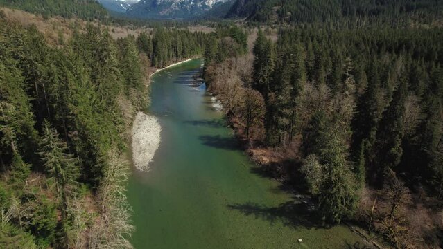 Drone Over River Revealing Mountain Ridge