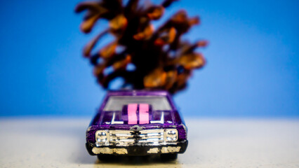 Minahasa, Indonesia : December 2022, the toy car transporting pinecones