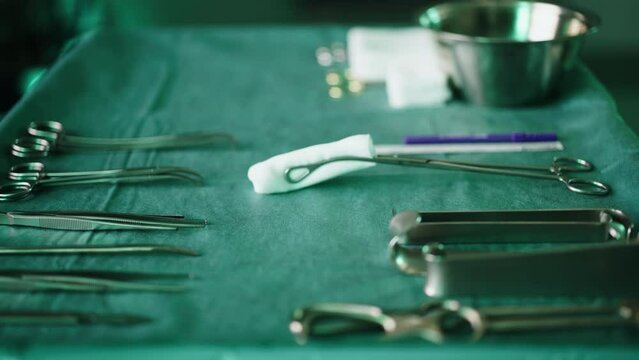 Surgical instruments and tools  arranged on a table for a surgery.