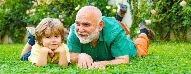 Grandfather and grandson, spring banner. Two different generations ages: grandfather and grandson...