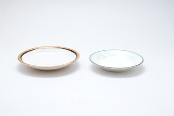 Empty ceramic water coasters. Decorative pattern for coffee cup isolated on white background. Modern mug tea, coffee, or milk. Shiny bright color glazed vintage handmade for drinking water