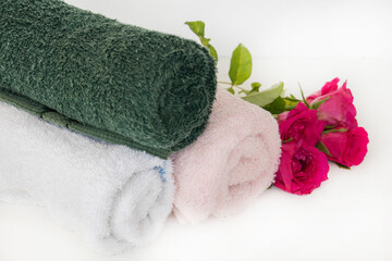 terry cloth health care for a bath with flowers rose arrangement flat lay style on background white 