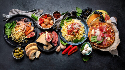 Dinner table of italian meals dishes. - obrazy, fototapety, plakaty