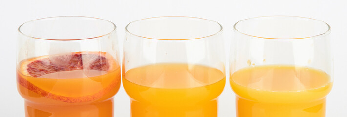 Fruit juices assortment on light background.