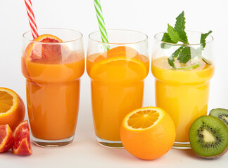 Fruit juices assortment on light background.