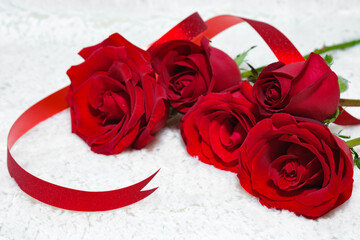 Valentine's day date 14 february. Background with red roses bouquet on white background. Greeting card template for Valentines Day. Copy space for text.