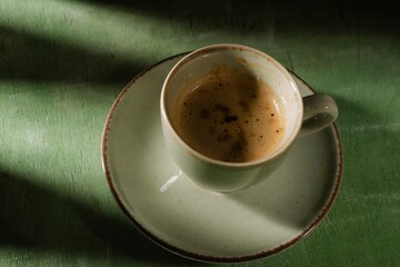 Cup of coffee for morning breakfast. Still life food - dark photo style. Culinary background - appetizing mood