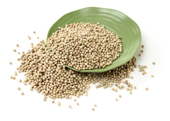 White peppercorns on white background