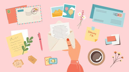 Female hand holding open envelope with writing a letter. Stamps, postcards, photo cards, stickers and a cup of coffee top view pink background. Vector flat illustration