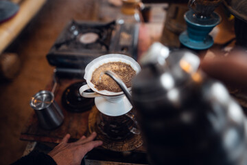 Fototapeta na wymiar Closeup of hands barista make coffee