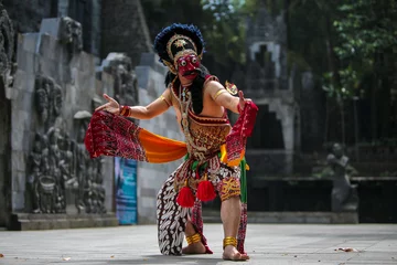 Raamstickers Man practicing Javanese traditional mask dance in Yogyakarta © Simon