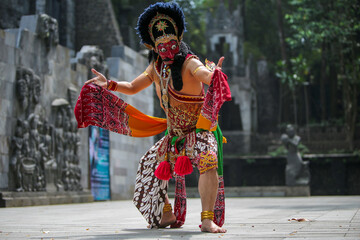 Very talented male dancer practicing traditional mask dance in Yogyakarta